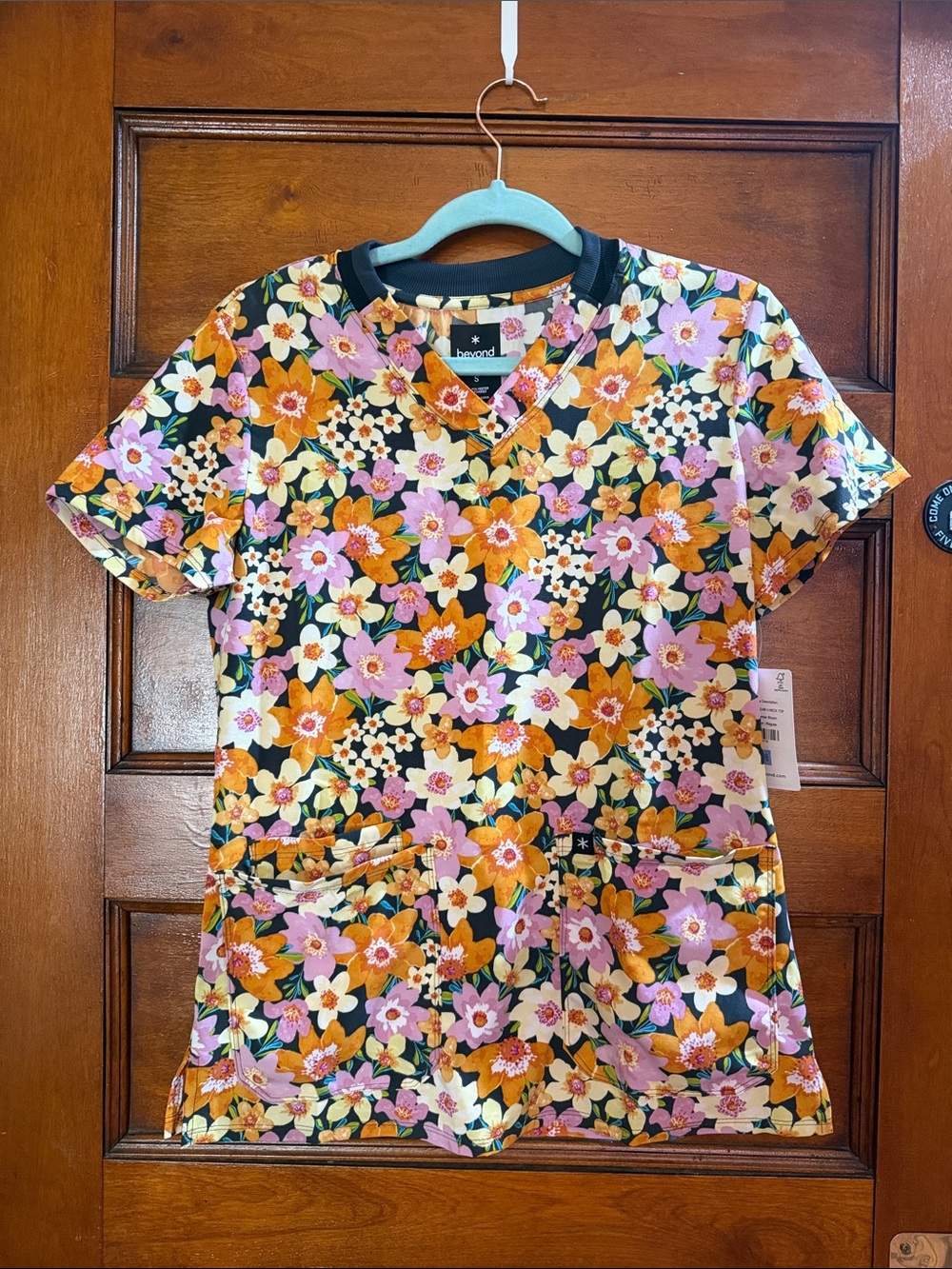 Beyond Scrubs Floral Print Medical Scrub Top - Black with Pink & Orange Flowers